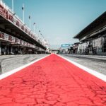 a race track with a red and white line painted on it