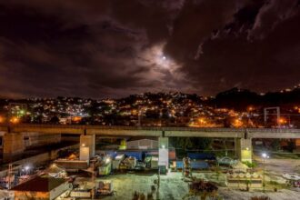 city with high rise buildings during night time