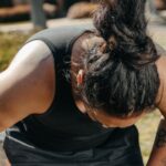 a man touching his knees
