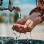 a person washing her hands