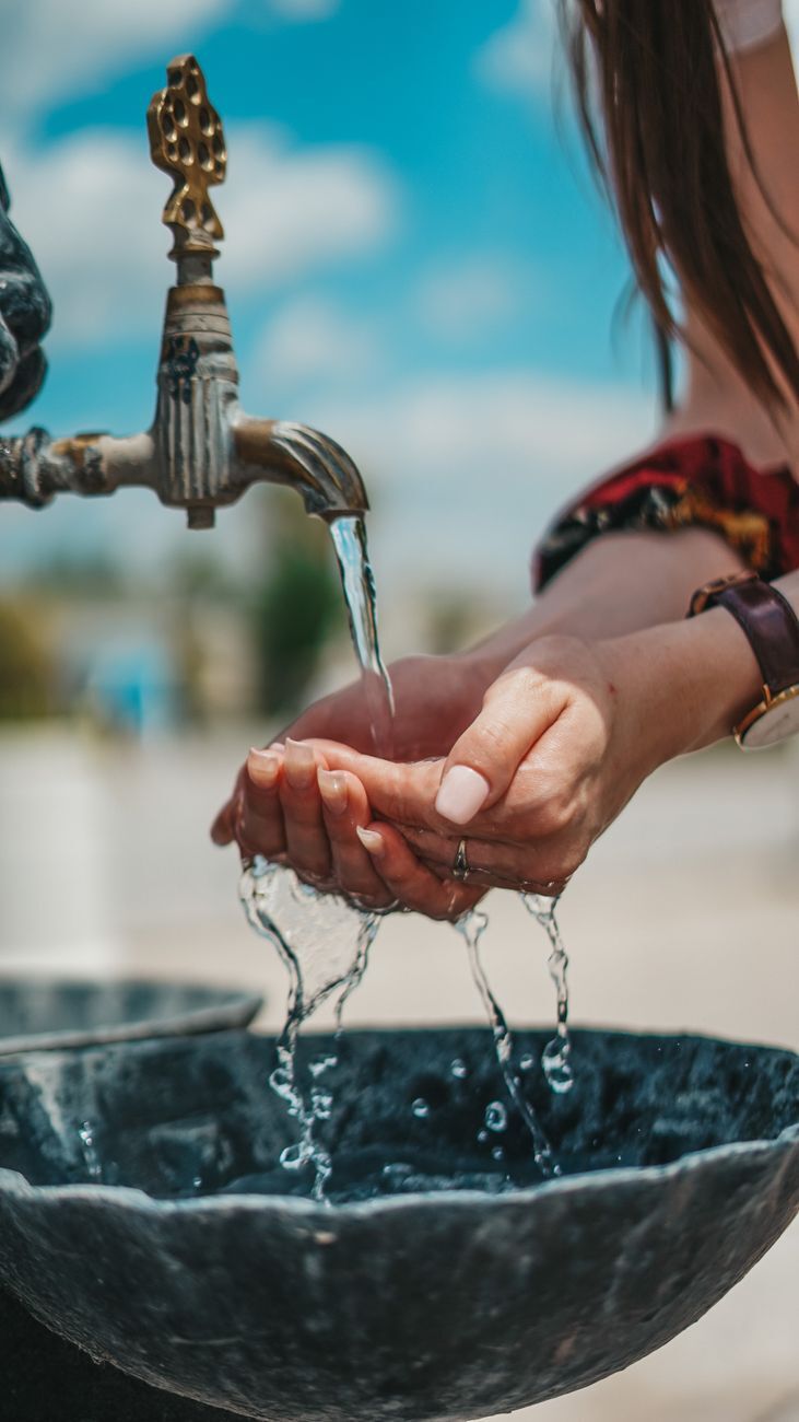 a person washing her hands
