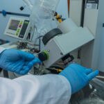 scientist operating rotary evaporator in laboratory
