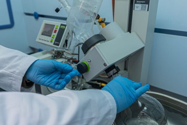 scientist operating rotary evaporator in laboratory