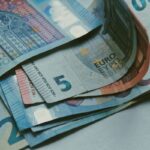 close up shot of euros on white surface