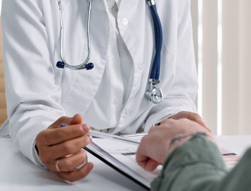 hands of doctor and patient on table